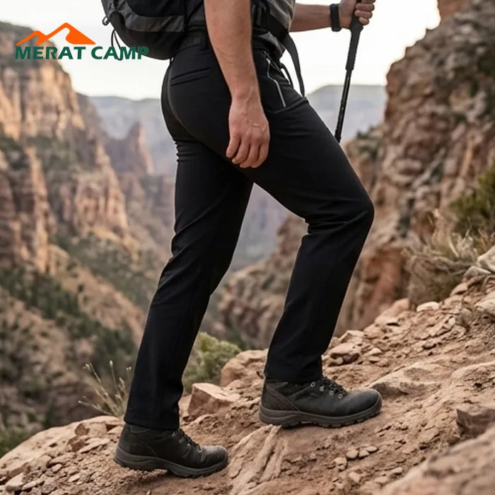 خرید شلوار کوهنوردی کلمبیا مدل Softshell داخل پلار رنگ مشکی نما از کنار در کوه