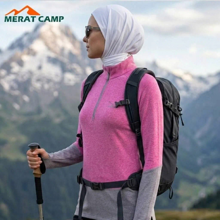 نیم زیپ کوهنوردی زنانه اسنوهاک مدل فینگر دار رنگ صورتی در طبیعت